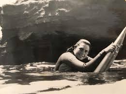 Brenda Scott surfing in competition