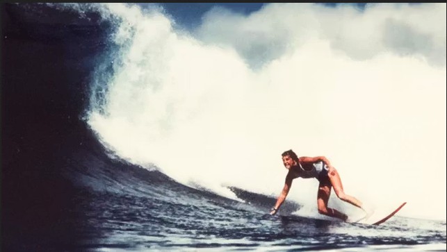 Brenda Scott riding a big wave